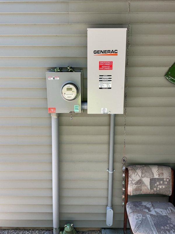 Completed installation of a 14KW Generac standby generator system with integrated 200-amp automatic transfer switch (ATS). Mounted the generator unit on a new concrete pad with proper gravel base for drainage and vibration dampening. Installed the ATS adjacent to the existing electrical meter on exterior wall using appropriate conduit and wiring per NEC standards. Extended natural gas service line from existing meter to generator location using approved piping and fittings. All electrical connections were made to safely integrate the backup power system with the main electrical service panel. System was tested for proper automatic transfer function during simulated power outage conditions. Verified all safety interlocks, emergency disconnect functionality, and proper operation of the generator under load. First year of scheduled maintenance included with installation to ensure optimal performance and warranty compliance.