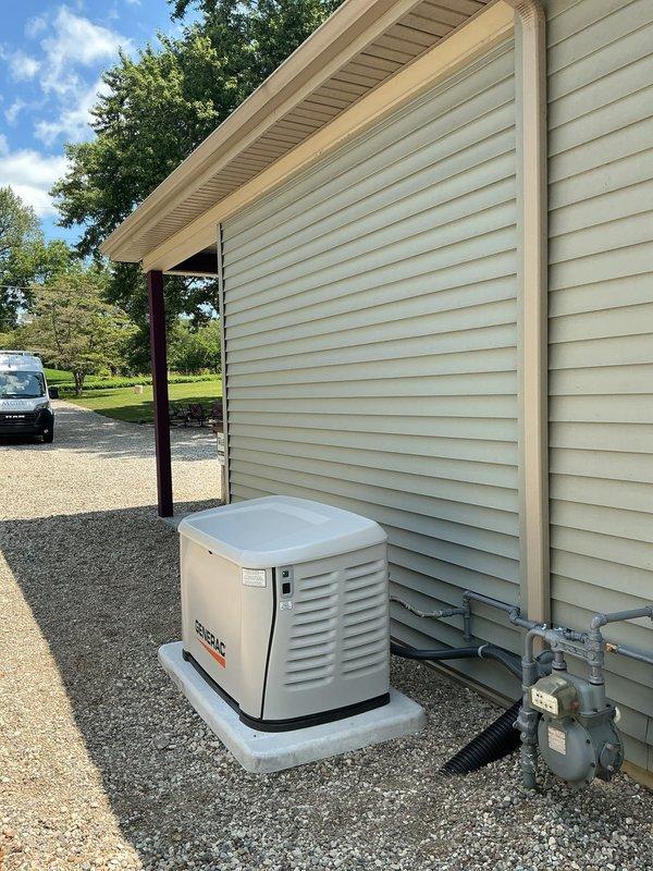 Completed installation of a 14KW Generac standby generator system with integrated 200-amp automatic transfer switch (ATS). Mounted the generator unit on a new concrete pad with proper gravel base for drainage and vibration dampening. Installed the ATS adjacent to the existing electrical meter on exterior wall using appropriate conduit and wiring per NEC standards. Extended natural gas service line from existing meter to generator location using approved piping and fittings. All electrical connections were made to safely integrate the backup power system with the main electrical service panel. System was tested for proper automatic transfer function during simulated power outage conditions. Verified all safety interlocks, emergency disconnect functionality, and proper operation of the generator under load. First year of scheduled maintenance included with installation to ensure optimal performance and warranty compliance.