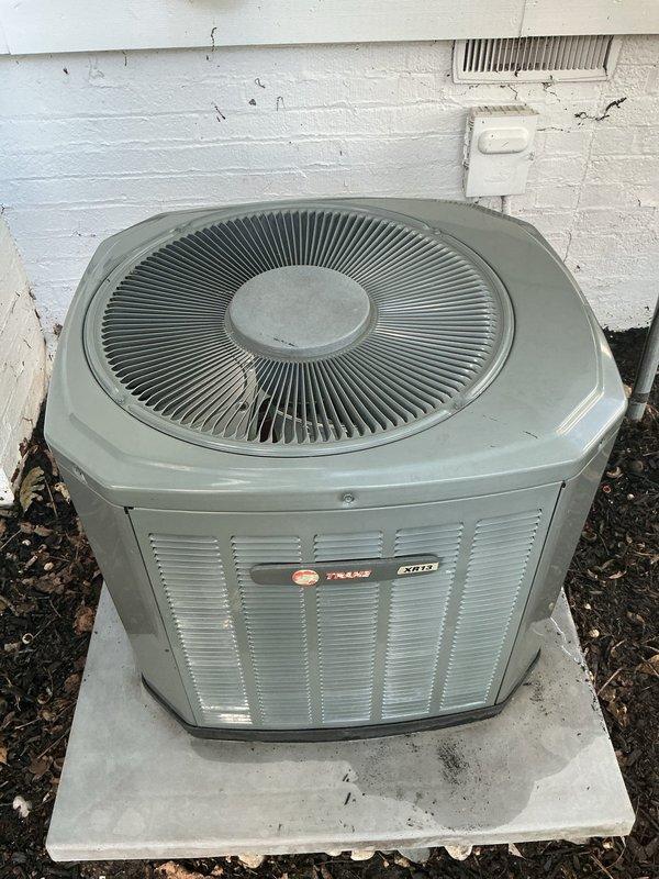 Performed preventive maintenance and cleaning on two residential air conditioning systems. The first unit, a Trane XL15i condensing unit, was inspected and serviced at its location on the side of the residence. The second AC unit was similarly maintained at its exterior position. Both systems received thorough cleaning of condenser coils, inspection of electrical connections, and verification of proper operation. All components were found to be functioning within normal parameters following the tune-up procedures.