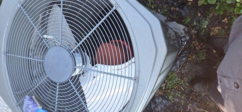 Completed heat pump tune-up in cooling mode on outdoor condensing unit. Performed comprehensive inspection of compressor, fan motor, and electrical components. Cleaned condenser coils to remove debris and vegetation buildup, improving heat transfer efficiency. Verified proper refrigerant levels and system pressures. Tested fan operation and confirmed adequate airflow through protective grille. Inspected unit housing and mounting pad for stability. System operating within manufacturer specifications upon completion.