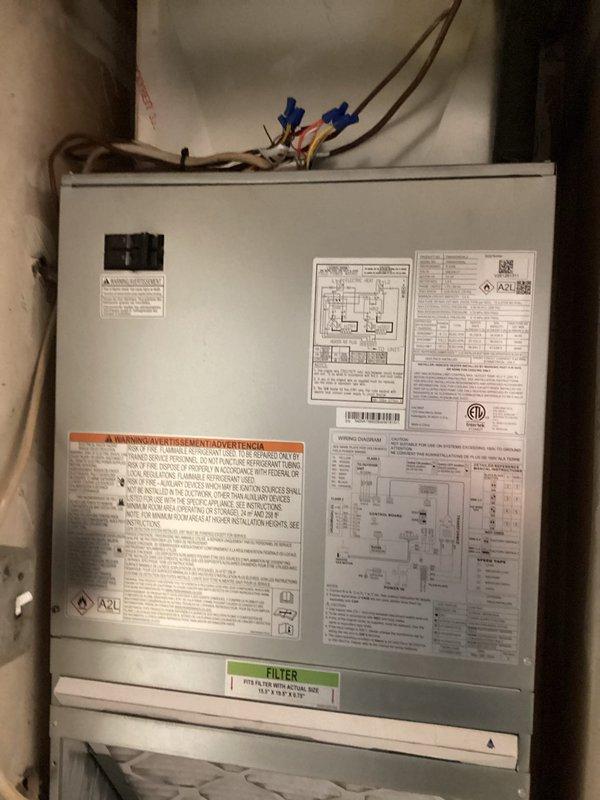 Completed full HVAC system installation consisting of a Carrier 2.0-ton, 15 SEER heat pump with R454B refrigerant and matching wall-mount air handler equipped with 8kW electric heat strips. Reconnected unit to existing supply ductwork, high and low voltage wiring, and refrigerant line set. Flushed and pressure tested refrigerant lines to verify system integrity, with final pressure readings confirming proper charge and no leaks. Installed Honeywell T-6 digital thermostat and programmed for heat pump operation. Applied identification labels to outdoor heat pump unit per code requirements. All work completed with required permits, and system tested for proper heating and cooling operation.