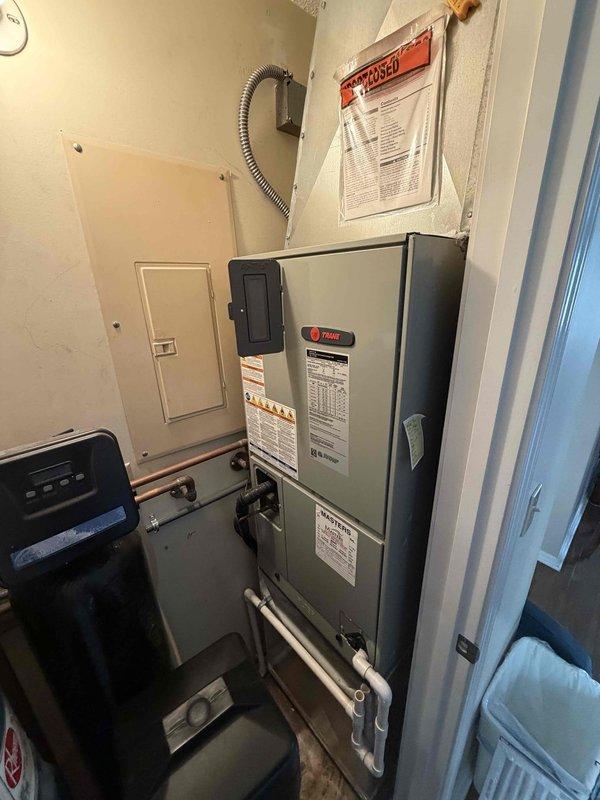 Completed comprehensive air conditioning tune-up on 13-year-old Trane system including indoor air handler and outdoor condenser unit. Performed standard maintenance protocol: inspected electrical connections and disconnect box, checked thermostat operation, verified condensate drain line functionality, cleaned condenser coils, examined fan operation on outdoor unit, and replaced air filter. All components found operating within normal parameters with no deficiencies noted; system performing efficiently for age of equipment.