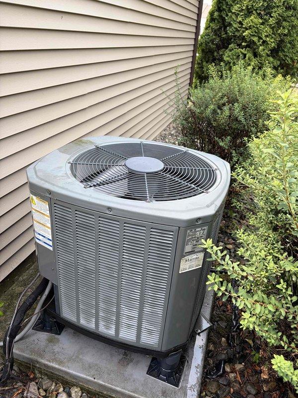 Completed comprehensive air conditioning tune-up on 13-year-old Trane system including indoor air handler and outdoor condenser unit. Performed standard maintenance protocol: inspected electrical connections and disconnect box, checked thermostat operation, verified condensate drain line functionality, cleaned condenser coils, examined fan operation on outdoor unit, and replaced air filter. All components found operating within normal parameters with no deficiencies noted; system performing efficiently for age of equipment.