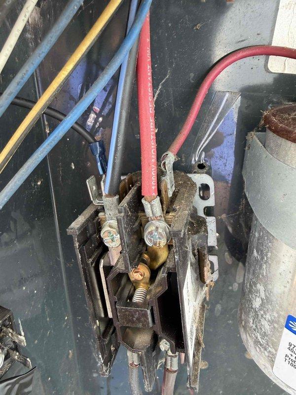 Responded to no cooling call on 11-year-old air conditioning system that had completely stopped operating. Upon inspection, found failed contactor with severely corroded contacts and terminals preventing compressor and condenser fan operation. Replaced defective contactor, secured all electrical connections with proper ring terminals, and verified system startup. Unit restored to normal cooling operation with all components functioning properly.