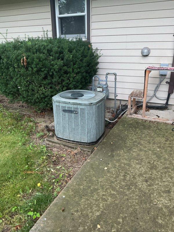 Conducted comprehensive assessment of residential air conditioning system experiencing no cooling condition. Evaluated outdoor condensing unit positioned on concrete pad adjacent to home exterior, inspecting compressor operation, refrigerant levels, and electrical connections. Examined indoor air return vent and distribution system for proper airflow and potential restrictions. Documented existing equipment condition including condenser coil, fan assembly, and associated electrical components. Provided detailed replacement estimate for complete AC system upgrade to restore cooling functionality and improve overall efficiency.