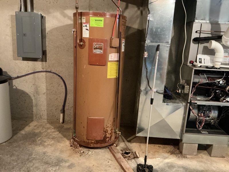 Completed routine cooling system maintenance on residential air conditioning unit in proper working condition. Performed comprehensive AC tune-up inspection including visual assessment of mechanical room equipment, verified system operation, and documented equipment conditions with photographic records for service history files.