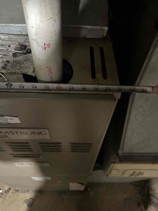 Conducted on-site assessment for gas furnace replacement in residential property. Evaluated existing 90% efficiency upflow furnace system, documented current Armstrong equipment configuration, and measured existing ductwork connections to determine proper sizing requirements for new Lennox unit installation. Photographed equipment layout, clearances, and mechanical room conditions to prepare comprehensive replacement estimate.