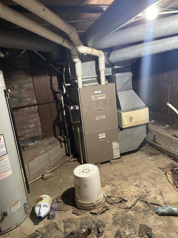 Conducted on-site assessment for gas furnace replacement in residential property. Evaluated existing 90% efficiency upflow furnace system, documented current Armstrong equipment configuration, and measured existing ductwork connections to determine proper sizing requirements for new Lennox unit installation. Photographed equipment layout, clearances, and mechanical room conditions to prepare comprehensive replacement estimate.