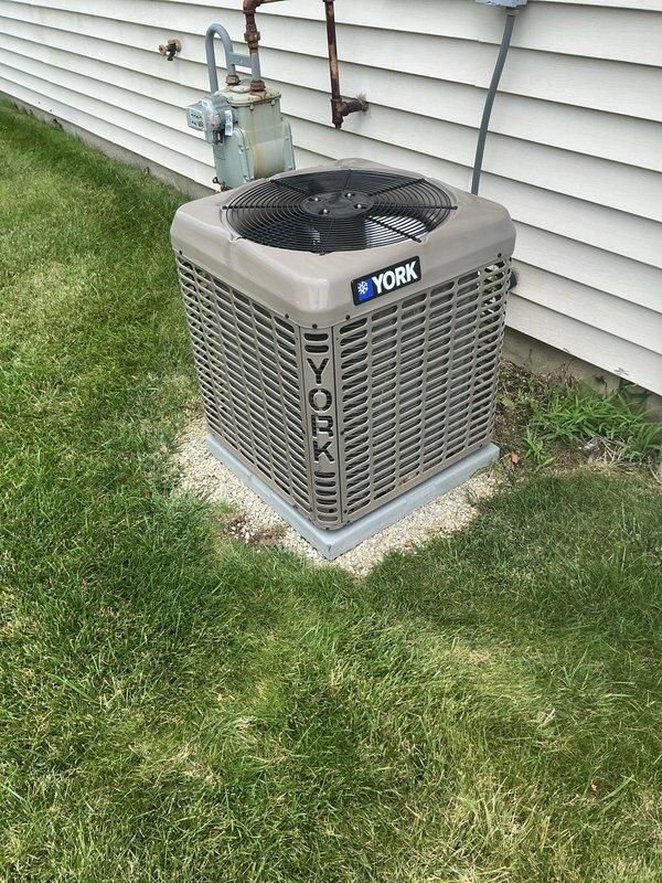 Completed routine preventative maintenance on a 2-year-old York air conditioning system. Performed comprehensive tune-up including inspection of outdoor condenser unit, indoor furnace coil, refrigerant lines, and all electrical connections. System found operating within normal parameters with no deficiencies noted; all components functioning properly upon completion of service.