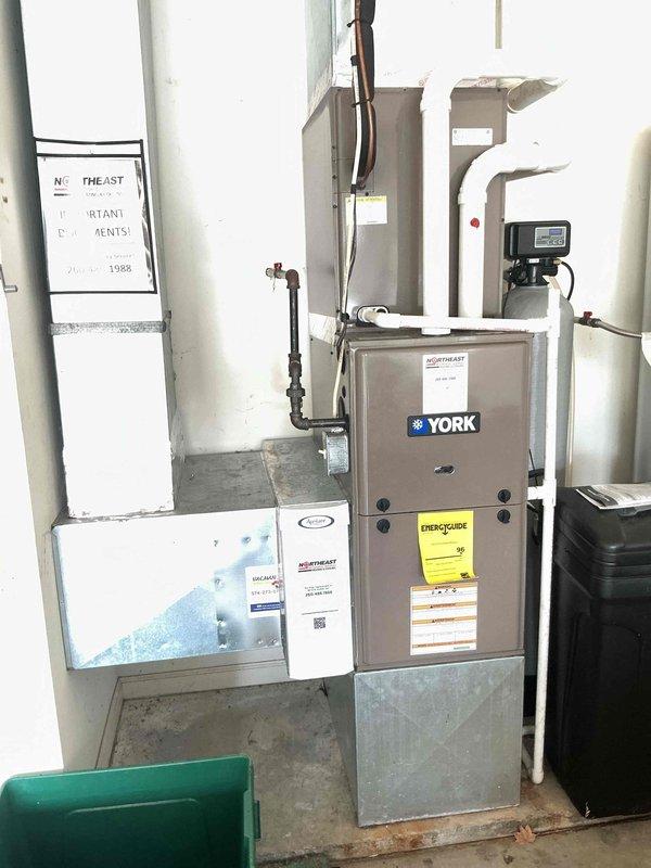 Completed routine preventative maintenance on a 2-year-old York air conditioning system. Performed comprehensive tune-up including inspection of outdoor condenser unit, indoor furnace coil, refrigerant lines, and all electrical connections. System found operating within normal parameters with no deficiencies noted; all components functioning properly upon completion of service.