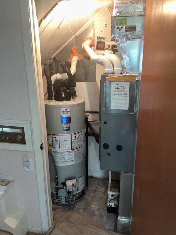 Completed full HVAC system installation in residential utility closet with space constraints requiring coordination with plumbing work. Removed and recycled existing equipment, then installed new Carrier 26SPA630W003 Performance Series single-stage air conditioner and Carrier CVAVA3617XMA evaporator coil. Repositioned furnace lower in closet to achieve proper PVC condensate drain positioning per specifications. Reconnected existing supply and return ductwork to air handler. Flushed, pressure tested, and reconnected to existing refrigerant line set. Installed new electrical disconnect and whip for outdoor unit. Set outdoor condenser on new 2-inch PVC pad with pea gravel base for proper drainage and stability. Verified all connections, performed system startup, and confirmed proper operation of complete cooling system. Registered equipment warranty with manufacturer. Conducted system operation walkthrough explaining thermostat controls and maintenance requirements. Senior technician perf