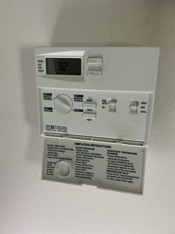 Conducted comprehensive assessment of 26+ year-old HVAC system including air conditioning unit, LP furnace, and water heater for complete replacement estimate. Evaluated existing Lux TX500b programmable thermostat and standard HVAC control wiring configuration with proper terminal connections (G, Y, W, RH, RC). Provided replacement options including heat pump system as more economical alternative to current LP heating source, documenting equipment specifications and system requirements for full system upgrade.