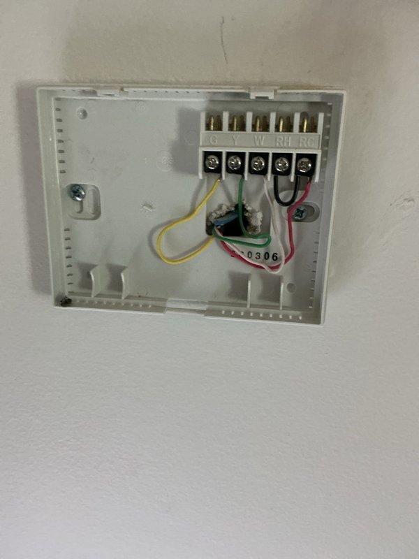 Conducted comprehensive assessment of 26+ year-old HVAC system including air conditioning unit, LP furnace, and water heater for complete replacement estimate. Evaluated existing Lux TX500b programmable thermostat and standard HVAC control wiring configuration with proper terminal connections (G, Y, W, RH, RC). Provided replacement options including heat pump system as more economical alternative to current LP heating source, documenting equipment specifications and system requirements for full system upgrade.