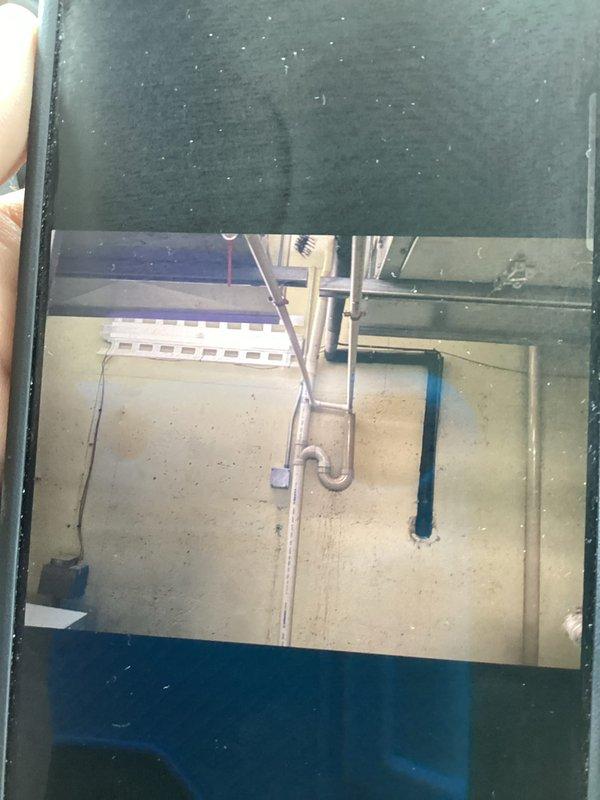 Responded to callback for water leak from HVAC unit. Upon arrival, inspected indoor air handler, condensate drain system, and associated piping in basement mechanical room. Documented conditions of PVC condensate lines, ductwork connections, and surrounding utility area with photos. Verified drain line routing, checked for blockages or improper pitch, and assessed potential sources of water discharge. Addressed customer concerns regarding previous service visit and confirmed resolution of water leak issue.