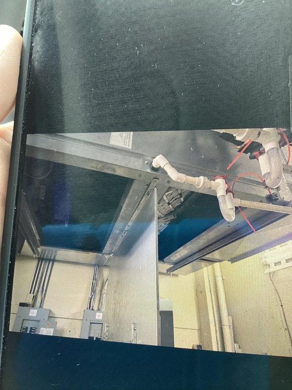 Responded to callback for water leak from HVAC unit. Upon arrival, inspected indoor air handler, condensate drain system, and associated piping in basement mechanical room. Documented conditions of PVC condensate lines, ductwork connections, and surrounding utility area with photos. Verified drain line routing, checked for blockages or improper pitch, and assessed potential sources of water discharge. Addressed customer concerns regarding previous service visit and confirmed resolution of water leak issue.