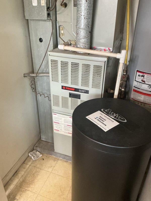 Completed HVAC estimate for equipment replacement in residential mechanical room. Assessed existing Trane furnace, A.O. Smith water heater, ductwork configuration, electrical connections, and gas line routing. Documented current system layout including ventilation components, expansion tank, and utility connections. Photographed equipment conditions, clearances, and existing infrastructure to provide comprehensive replacement recommendations and specifications.