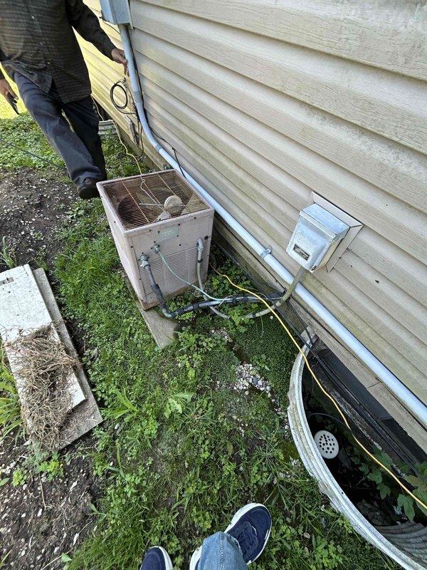Conducted comprehensive assessment of existing HVAC system for replacement estimate. Evaluated outdoor Carrier condenser unit showing significant age and weathering, with deteriorated casing and worn components. Inspected refrigerant line routing along building exterior and electrical disconnect. Assessed indoor Carrier furnace installation in basement mechanical room, including existing ductwork configuration, gas line connections, and ventilation system. Documented current equipment specifications and installation conditions to provide accurate replacement recommendations for complete system upgrade.