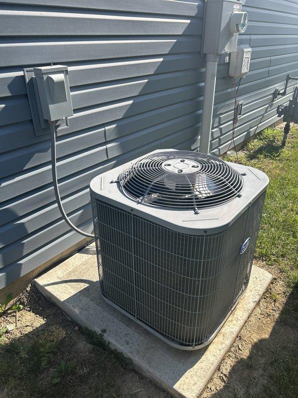 Conducted comprehensive assessment of existing HVAC system following previous inspection indicating failed evaporator coil. Evaluated outdoor condensing unit positioned on concrete pad with electrical disconnect and utility connections. Provided detailed replacement estimate for air conditioning system with optional furnace replacement based on equipment compatibility and system efficiency requirements. Documented current equipment configuration including condenser unit, electrical service connections, and gas utility infrastructure to determine optimal replacement specifications.