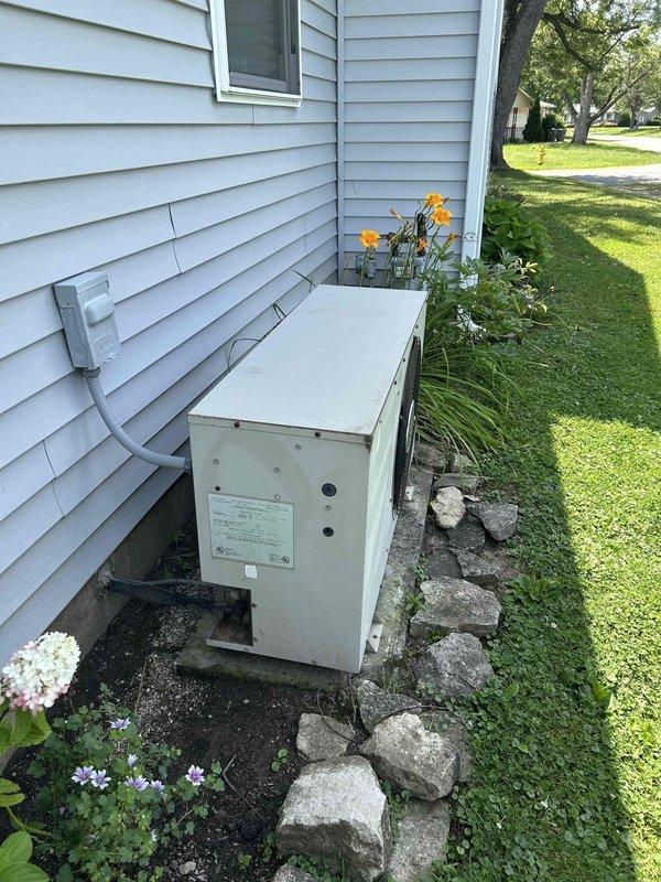 Conducted on-site assessment for complete HVAC system replacement including gas furnace and air conditioning unit. Evaluated existing furnace installation in basement utility room, noting current configuration with PVC exhaust and intake venting system. Inspected outdoor condensing unit positioned on exterior pad against home's foundation. Documented equipment specifications, dimensions, and existing infrastructure including electrical service, gas connections, and ductwork routing to provide accurate replacement quote for both heating and cooling systems.
