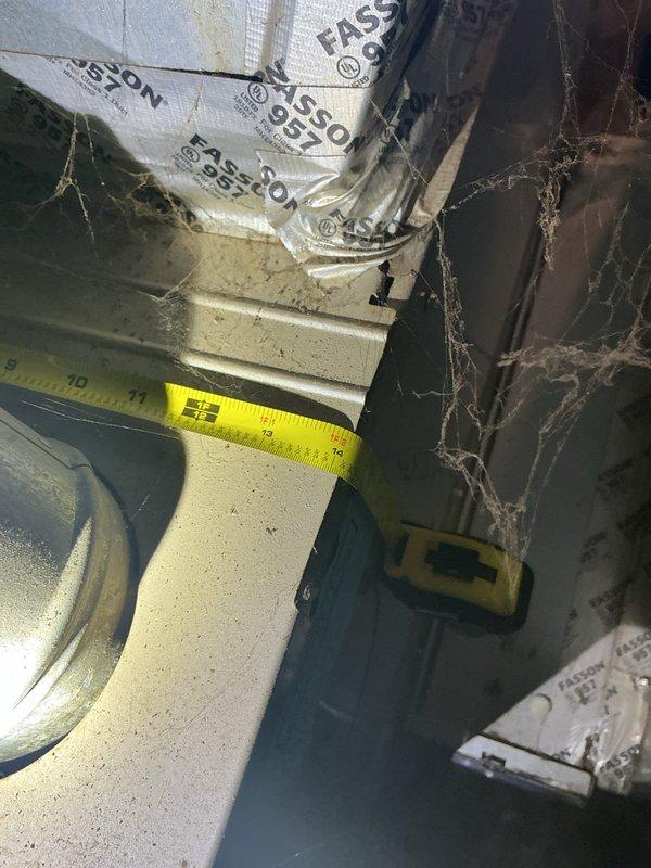 Conducted comprehensive system evaluation for complete HVAC replacement estimate following previous no-cooling service call. Assessed existing air conditioning unit, furnace, and water heater for replacement recommendations. Documented current equipment conditions including aged ductwork with visible dust accumulation, flexible duct connections showing wear and discoloration, and deteriorated insulation throughout the system. Measured attic space accessibility and photographed existing infrastructure to provide accurate replacement specifications. Customer approved estimate and selected equipment options for complete system replacement.