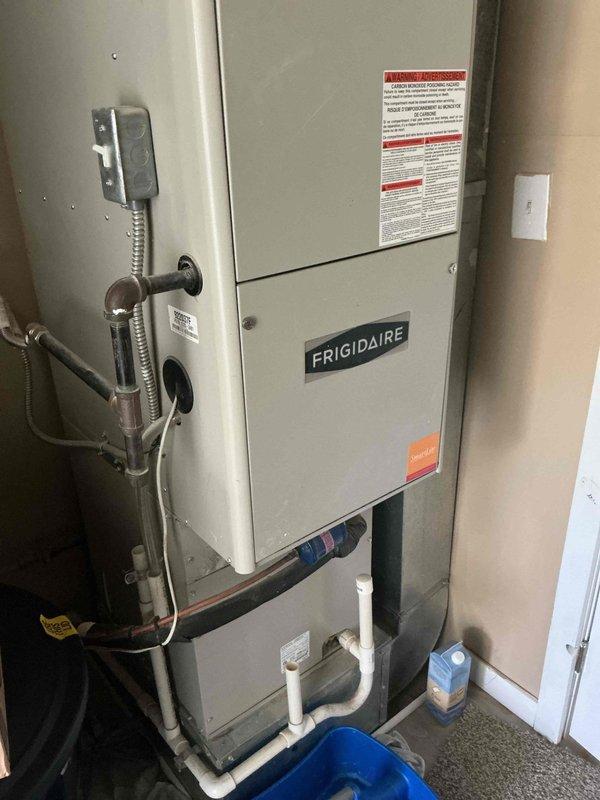 Performed routine cooling system maintenance on Frigidaire HVAC unit model 922037F. Inspected furnace cabinet, verified proper operation of all components, and checked condensate drain lines for proper drainage. All systems found to be operating within normal parameters.