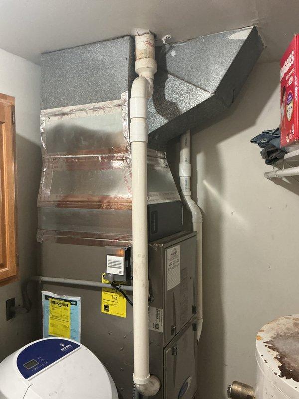 Completed half-system replacement installation of Carrier Comfort Series 26SCA436N003 single-stage air conditioner with matching Carrier CVAVA4217XMA evaporator coil. Removed and recycled existing outdoor condensing unit and indoor coil, then installed new equipment utilizing existing supply and return ductwork in indoor utility area. Reconnected to existing refrigerant line set after performing complete flush and pressure test to ensure system integrity. Installed new outdoor condensing unit on 2-inch PVC pad with pea gravel base for proper drainage and leveling, mounted new electrical disconnect box and whip for code-compliant power supply. Completed all refrigerant connections, performed leak test, evacuated system, and charged to manufacturer specifications. Verified proper airflow, temperature split, and operational performance of single-stage cooling system. Registered manufacturer warranty coverage for both air conditioner and evaporator coil providing 10-year limited parts prot
