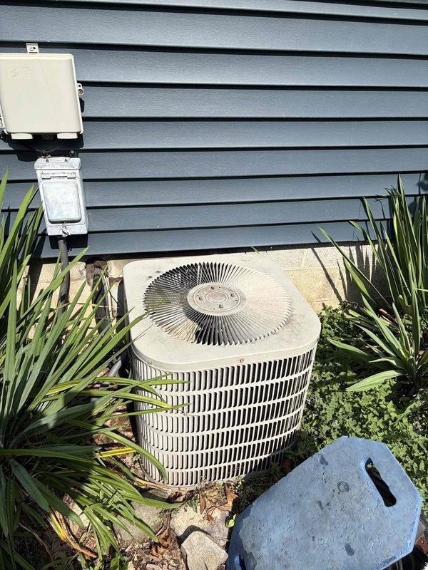Completed preventive maintenance on residential air conditioning system at rental property. Inspected outdoor condenser unit, which showed signs of age and weathering with visible dirt accumulation on exterior surfaces and top panel. Examined electrical terminal connections and found significant buildup of dirt, dust, and debris on wiring and terminal block components. Performed standard cooling season maintenance procedures including inspection of condenser coils, verification of electrical connections across multiple circuits, and assessment of unit operation. System operational upon completion of maintenance visit.