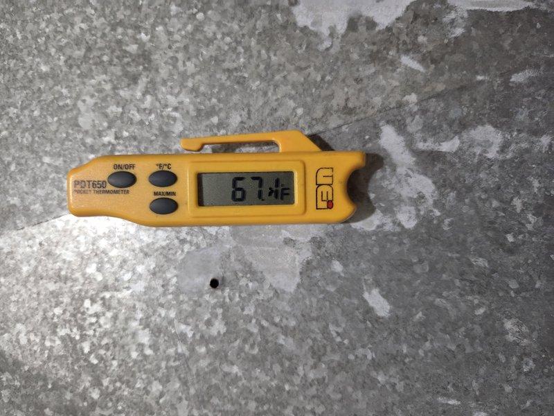 Responded to no cooling callback where thermostat was set to 70°F but indoor temperature remained at 72°F. Upon arrival, performed temperature verification using calibrated digital thermometer, confirming supply air temperature of 67.4°F at register, indicating system was producing adequate cooling. Compared thermostat display readings with actual measured temperatures to verify proper sensor operation and system cycling. System found operating within normal parameters with appropriate temperature differential between supply air and ambient conditions.