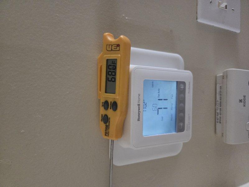 Responded to no cooling callback where thermostat was set to 70°F but indoor temperature remained at 72°F. Upon arrival, performed temperature verification using calibrated digital thermometer, confirming supply air temperature of 67.4°F at register, indicating system was producing adequate cooling. Compared thermostat display readings with actual measured temperatures to verify proper sensor operation and system cycling. System found operating within normal parameters with appropriate temperature differential between supply air and ambient conditions.