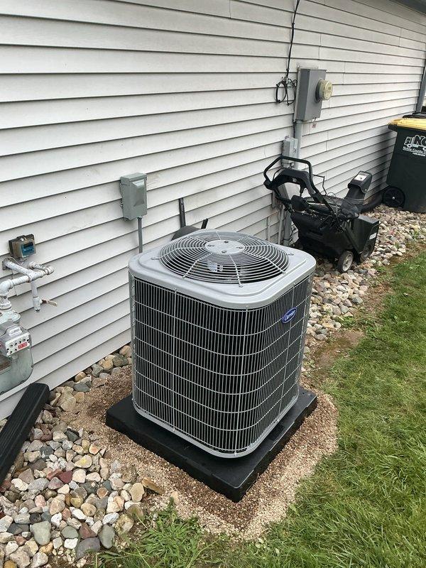 Completed full HVAC system installation including a Carrier 26SCA424N003 Comfort Series single-stage air conditioner and Carrier CVAVA3017XMA evaporator coil. Removed and recycled existing equipment, installed new outdoor condenser unit on 2-inch PVC pad with pea gravel base, and reconnected to existing line set after flushing and pressure testing. Installed new electrical disconnect and whip, reconnected existing supply and return ductwork to new evaporator coil, and verified all electrical connections met code requirements. Performed complete system startup, charged refrigerant to manufacturer specifications using digital manifold gauges, and confirmed proper subcooling and superheat readings. Conducted post-installation quality assurance walkthrough with senior technician, explained system operation, registered warranty, and verified all components operating within normal parameters.