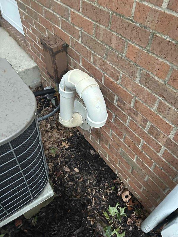Conducted comprehensive HVAC system evaluation for replacement estimate on residential forced-air heating and cooling system. Existing air conditioning unit demonstrated inadequate cooling performance with documented history of repeated refrigerant additions over multiple years, indicating probable refrigerant leak in system. Assessed basement-mounted gas furnace with accessible service panel and inspected outdoor condensing unit housed in protective cage on concrete pad against brick exterior wall. Documented existing equipment configuration including PVC condensate drainage system, copper refrigerant line sets, and ductwork connections. Provided replacement options for complete HVAC system upgrade to address cooling deficiency and aging equipment.