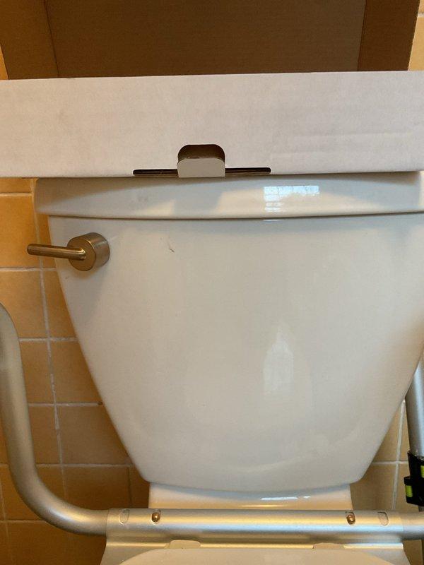 Installed customer-provided dual-flush button mechanism on toilet tank, replacing existing flush lever system. Verified proper operation of flush mechanism and confirmed watertight seal on tank lid assembly. Under-sink plumbing and garbage disposal connections inspected and confirmed to be functioning properly with no leaks detected.