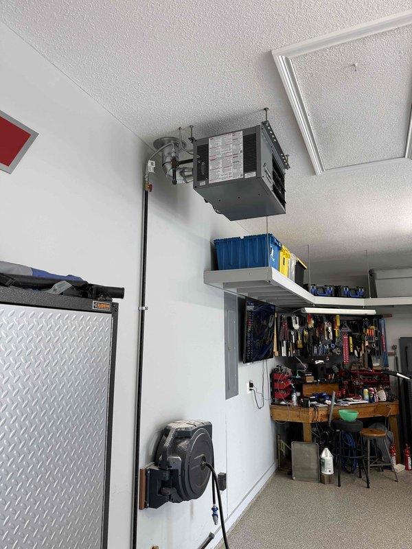 Successfully installed one Modine Hot Dawg unit heater (Model MDHD30AS0111, 30,000 BTU) in garage workspace, mounted near ceiling with proper ductwork connections. Converted unit to LP operation by installing and configuring LP conversion kit. Completed all manufacturer-specified startup procedures, verified proper operation, ignition sequence, and heat output to ensure system functionality and safety compliance.