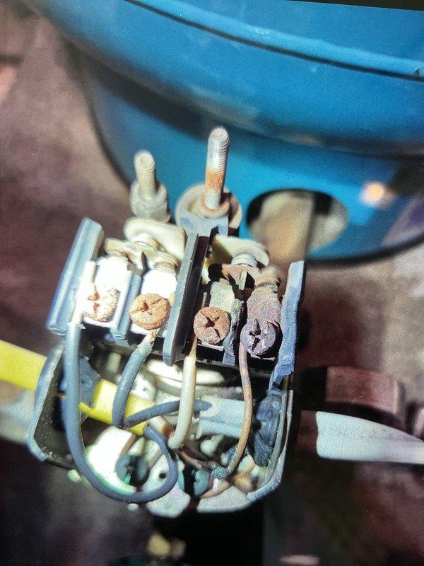 Completed first prepaid cooling maintenance visit on geothermal system. Upon inspection, discovered severe corrosion and deterioration on the contactor assembly, with extensive rust on terminals, bolts, and contact points indicating prolonged moisture exposure. Documented the compromised electrical component condition with photos and recommended immediate contactor replacement due to safety concerns and risk of system failure.