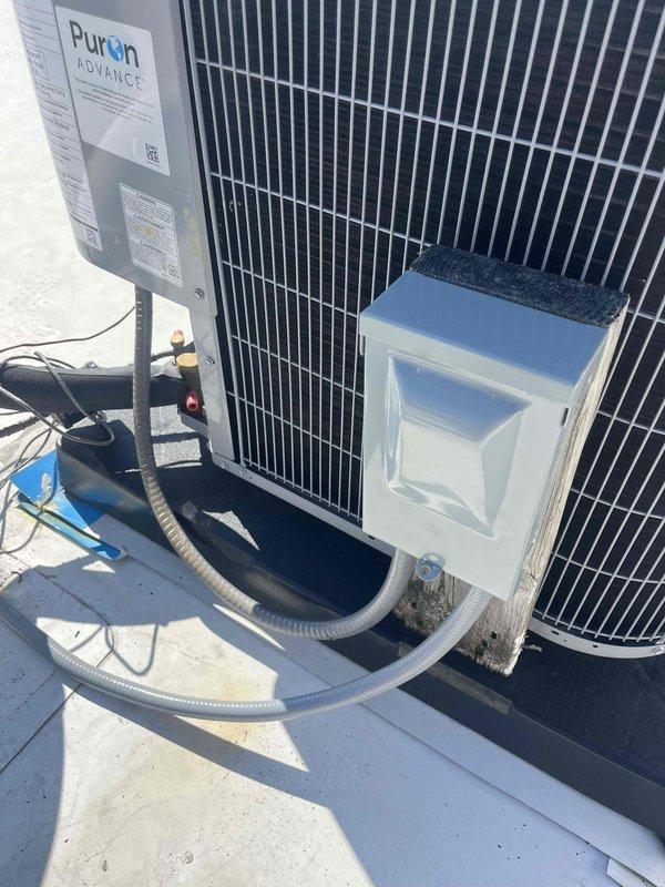 Responded to no cooling complaint on newly installed rooftop HVAC system. Upon arrival, verified outdoor condensing unit and associated electrical components were properly installed with correct refrigerant line connections and condensate drainage in place. System inspected and found to be operational with all connections secure and equipment functioning as designed.