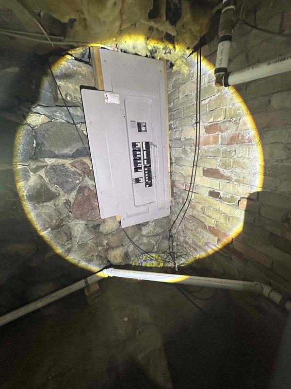 Conducted follow-up site assessment for full HVAC system replacement after previously quoting air conditioning unit only. Documented existing thermostat configuration and electrical service panel with proper circuit breaker arrangement to ensure compatibility with proposed heating and cooling equipment installation.