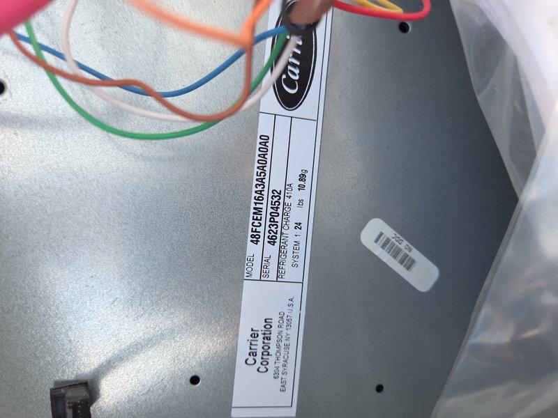 Responded to no cooling call on Carrier rooftop unit model 48TCEM16A45A00000 serving showroom area. Upon inspection, documented equipment nameplate information and examined refrigerant coil assembly with copper tubing loops and heat exchanger components. Unit assessed and customer contacted regarding findings.