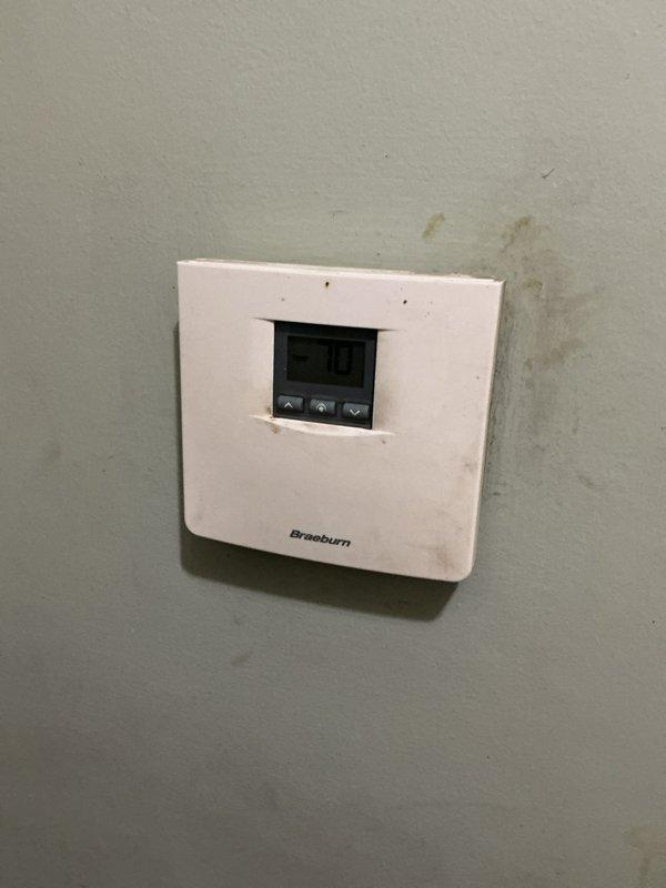 Conducted on-site assessment for gas furnace replacement in residential property. Evaluated existing HVAC system consisting of aging furnace unit with beige cabinet and adjacent water heater in basement mechanical room. Documented current equipment specifications, venting configuration with flexible ductwork, and existing Braeburn thermostat. Provided comprehensive replacement estimate for new gas furnace installation to address customer's heating system upgrade needs.