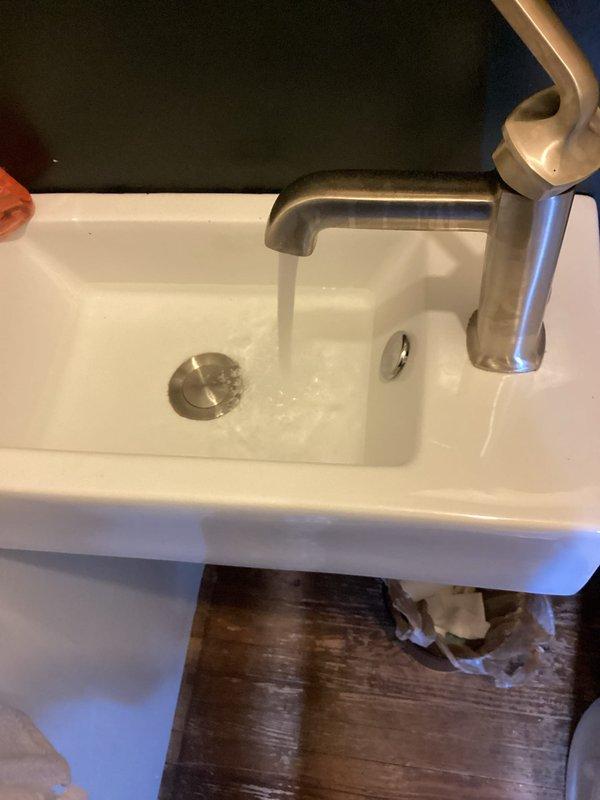 Performed routine plumbing maintenance inspection and tanked water heater flush as scheduled. Upon arrival, conducted comprehensive assessment of plumbing fixtures throughout the property. Inspected toilet tank components, noting functional flush valve assembly and fill valve mechanism with visible mineral deposits indicating normal wear. Tested water flow at bathroom sink faucet to verify proper operation and pressure. Completed standard water heater maintenance procedures including tank drainage and flushing to remove sediment buildup, ensuring optimal heating efficiency and extending equipment lifespan through 2027 maintenance cycle.