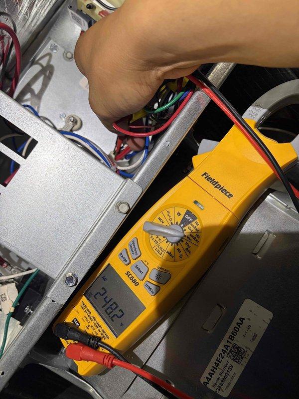 Responded to no cooling call at townhouse with 10+ year old HVAC system. Upon arrival, performed diagnostic testing of electrical components and control board using multimeter, which indicated 24.82V at low voltage terminals. Inspected refrigerant lines, control wiring, and internal components for proper operation. System evaluated and measurements documented for service records.