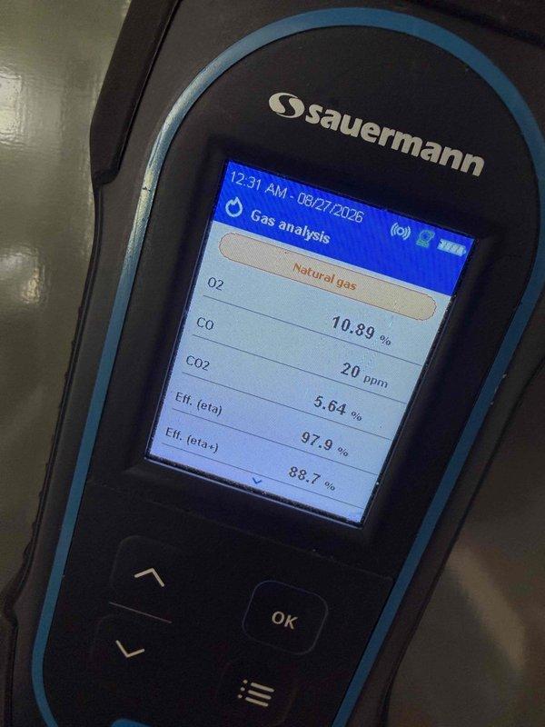 Performed comprehensive gas furnace tune-up in garage. Conducted combustion analysis using digital gas analyzer, measuring oxygen levels, carbon monoxide (10.89%), carbon dioxide (20 ppm), and combustion efficiency (97.9%). Verified proper temperature output at floor register using digital thermometer to ensure adequate heat distribution throughout the system.