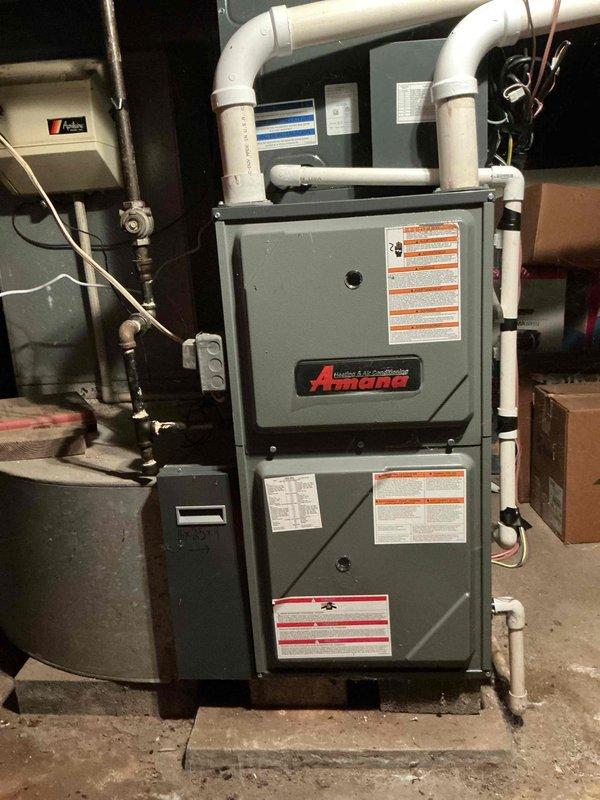 Performed comprehensive tune-up and safety inspection on Amana gas furnace system. Inspected all mechanical and electrical components, verified proper operation of burner assembly, heat exchanger, blower motor, and gas valve. Confirmed venting system integrity including PVC intake and exhaust pipes, checked condensate drainage, tested all safety controls, and verified proper gas pressure and combustion efficiency. System operating within manufacturer specifications with no issues identified.