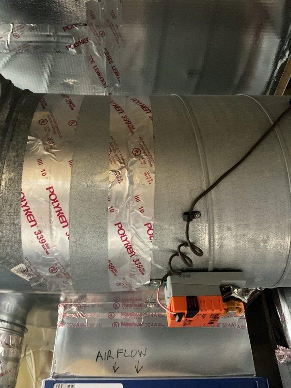 Responded to cooling issue with two-zone geothermal system where upstairs zone was not receiving adequate airflow while main level was overcooling. Diagnosed and replaced failed BELIMO LMB24-3-T zone damper actuator controlling airflow to upper level, restoring proper zone control and balanced temperature distribution throughout the home.