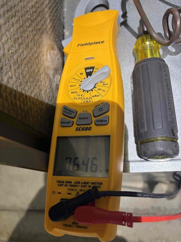 Completed comprehensive cooling system preventive maintenance inspection on residential air conditioning unit. Performed electrical diagnostics using digital multimeter, verifying proper voltage and amperage at terminal connections. Tested and measured capacitor performance, confirming microfarad rating within manufacturer specifications to ensure optimal compressor and fan motor operation.