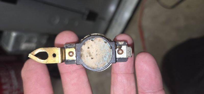Responded to service call for heating system malfunction. Diagnosed failed thermal limit switch showing significant heat damage and oxidation. Removed defective thermal fuse and strip heat board components, replaced with new parts, and restored system to proper operating condition.