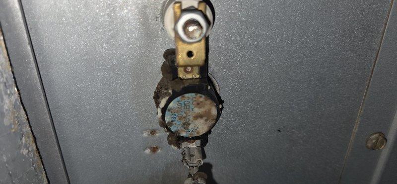 Responded to service call for heating system malfunction. Diagnosed failed thermal limit switch showing significant heat damage and oxidation. Removed defective thermal fuse and strip heat board components, replaced with new parts, and restored system to proper operating condition.