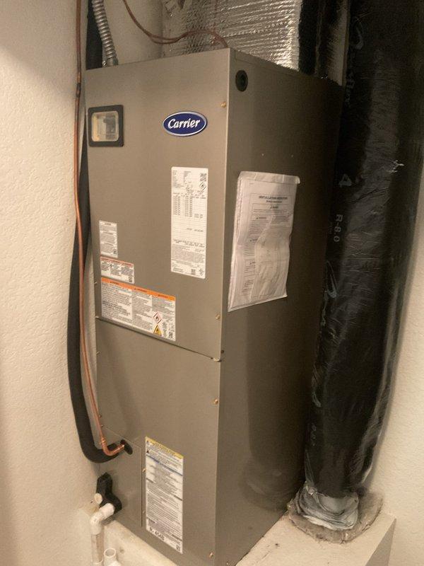 Removed and replaced existing 1.5 ton heat pump system operating on R410a refrigerant and 2 ton air handler with electric strip heat. Installed new Carrier GH5SANS1800A 1.5 ton single stage heat pump and Carrier FJ5ANXB24L00 2 ton single stage air handler, both operating on R454 refrigerant. Flushed and reused existing line set, reconnected to existing electrical power and disconnect, reused existing plenum, and reconnected to existing condensation drain. Set outdoor unit on new pad with risers, performed system startup and testing, and hauled away old equipment.