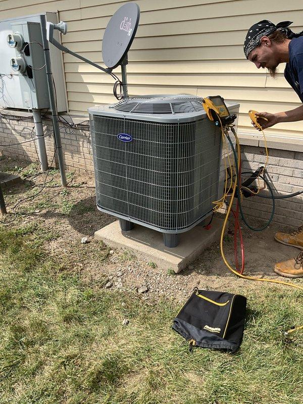 Removed and replaced existing 1.5 ton heat pump system operating on R410a refrigerant and 2 ton air handler with electric strip heat. Installed new Carrier GH5SANS1800A 1.5 ton single stage heat pump and Carrier FJ5ANXB24L00 2 ton single stage air handler, both operating on R454 refrigerant. Flushed and reused existing line set, reconnected to existing electrical power and disconnect, reused existing plenum, and reconnected to existing condensation drain. Set outdoor unit on new pad with risers, performed system startup and testing, and hauled away old equipment.