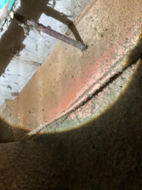 Responded to service call for leaking outdoor spigot and suspected pipe leak in crawl space. Accessed crawl space through 2'x2' closet opening to inspect plumbing infrastructure with approximately 3 feet of clearance. Documented corroded outdoor spigot fixture showing significant oxidation and mineral deposits, as well as pipe condition in crawl space area with exposed insulation. Advised customer that repair of outdoor spigot and associated piping may require coordination with city water department for main shutoff due to absence of property shutoff valve.