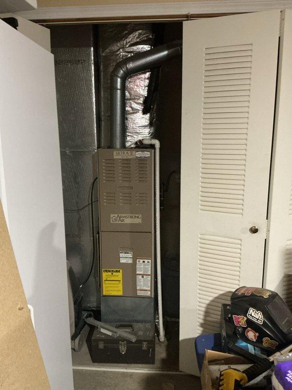 Completed system evaluation and estimate for replacement of existing Armstrong Air Ultra V furnace system. Customer reported unit was deemed non-repairable by previous assessment. Documented existing equipment specifications including 60,000 BTU input rating, 120V single-phase electrical configuration, and upflow installation in interior closet location. Photographed unit nameplate data and overall system configuration for replacement equipment sizing and proposal preparation.